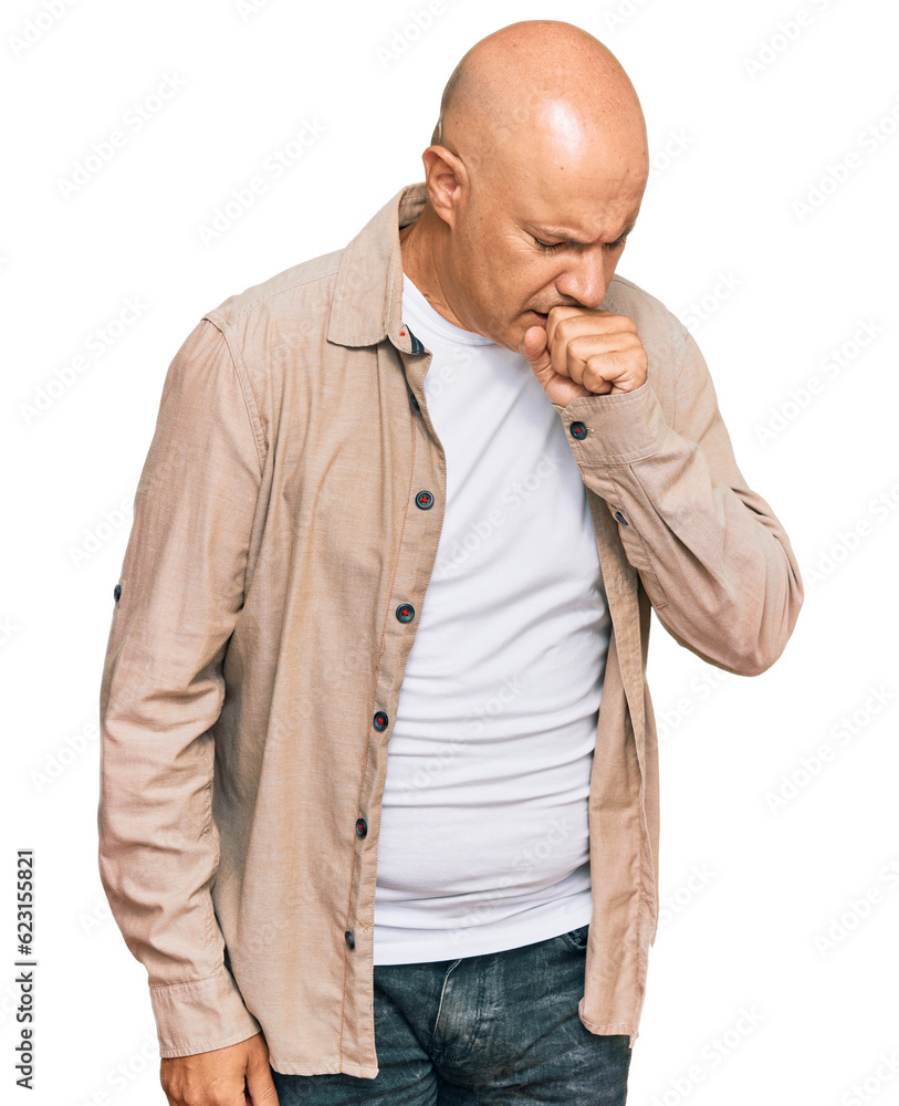 Middle age bald man wearing casual clothes feeling unwell and coughing as symptom for cold or bronchitis. health care concept. Middle age bald man wearing casual clothes feeling unwell and coughing as symptom for cold or bronchitis. health care concept.