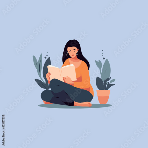 woman sitting quietly reading a book