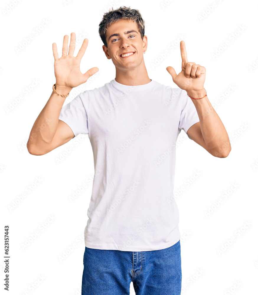 Young handsome man wearing casual white tshirt showing and pointing up with fingers number seven while smiling confident and happy. Young handsome man wearing casual white tshirt showing and pointing up with fingers number seven while smiling confident and happy.