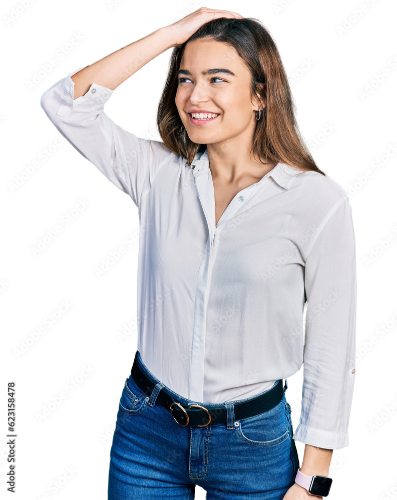 Young caucasian girl wearing casual white shirt smiling confident touching hair with hand up gesture, posing attractive and fashionable Young caucasian girl wearing casual white shirt smiling confident touching hair with hand up gesture, posing attractive and fashionable