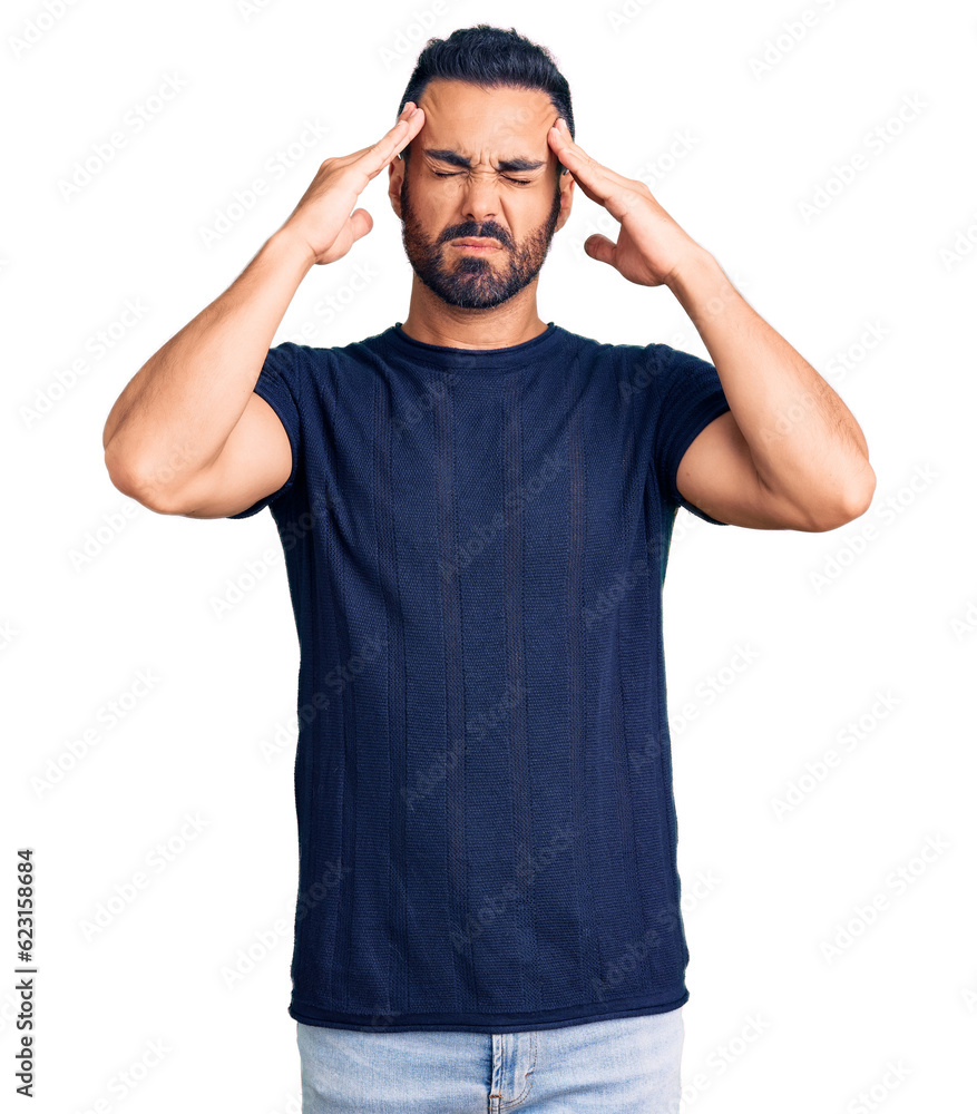 Young hispanic man wearing casual clothes suffering from headache desperate and stressed because pain and migraine. hands on head. Young hispanic man wearing casual clothes suffering from headache desperate and stressed because pain and migraine. hands on head.