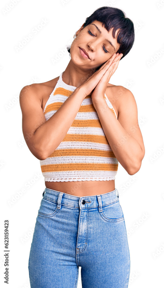 Young brunette woman with short hair wearing casual clothes sleeping tired dreaming and posing with hands together while smiling with closed eyes. Young brunette woman with short hair wearing casual clothes sleeping tired dreaming and posing with hands together while smiling with closed eyes.