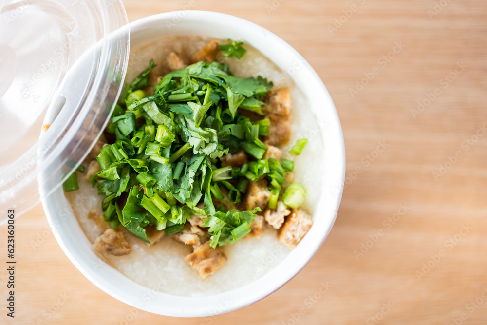Pork congee or rice porridge with minced pork sprinkled with coriander in white bowl for new morning. Asia breakfast Pork congee or rice porridge with minced pork sprinkled with coriander in white bowl for new morning. Asia breakfast
