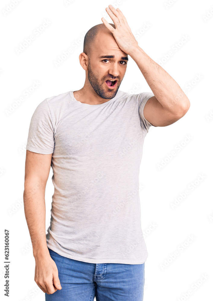 Young handsome man wearing casual t shirt surprised with hand on head for mistake, remember error. forgot, bad memory concept. Young handsome man wearing casual t shirt surprised with hand on head for mistake, remember error. forgot, bad memory concept.