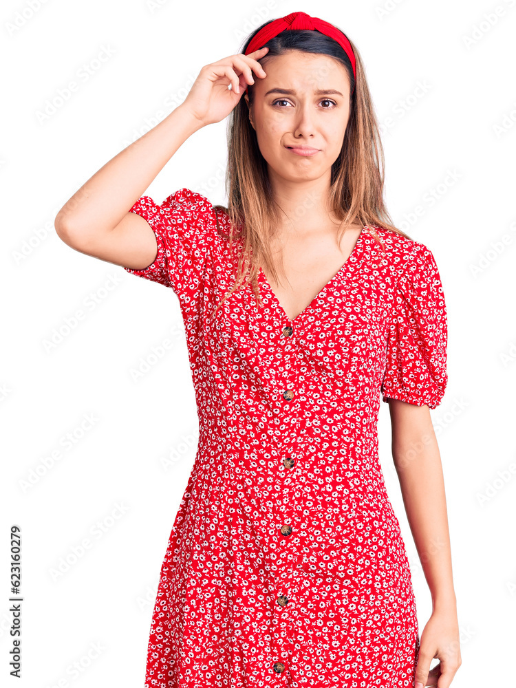 Young beautiful girl wearing dress and diadem worried and stressed about a problem with hand on forehead, nervous and anxious for crisis Young beautiful girl wearing dress and diadem worried and stressed about a problem with hand on forehead, nervous and anxious for crisis