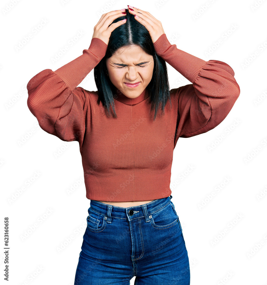 Young brunette woman with blue eyes wearing elegant sweater suffering from headache desperate and stressed because pain and migraine. hands on head. Young brunette woman with blue eyes wearing elegant sweater suffering from headache desperate and stressed because pain and migraine. hands on head.
