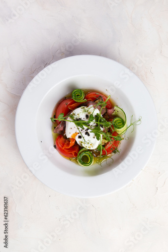 Salad with tomato and egg plows.