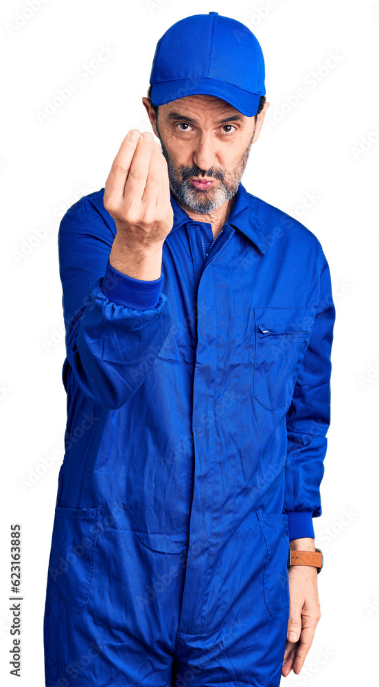 Middle age handsome man wearing mechanic uniform doing italian gesture with hand and fingers confident expression Middle age handsome man wearing mechanic uniform doing italian gesture with hand and fingers confident expression