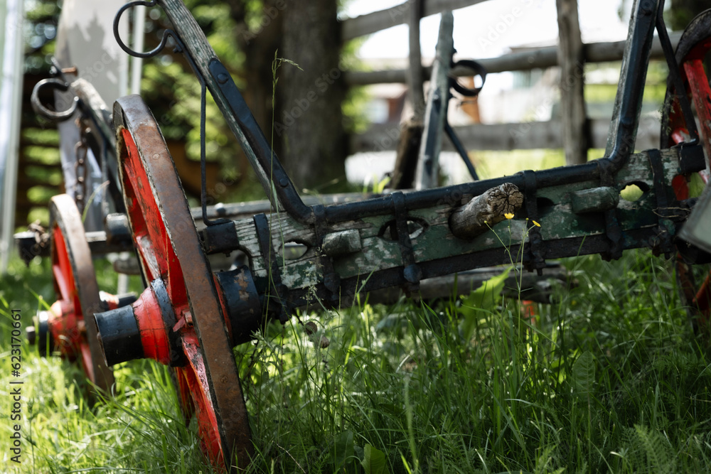 The old traditional dray is a captivating piece of history, embodying the charm and character of a bygone era with its weathered wood and rustic design.