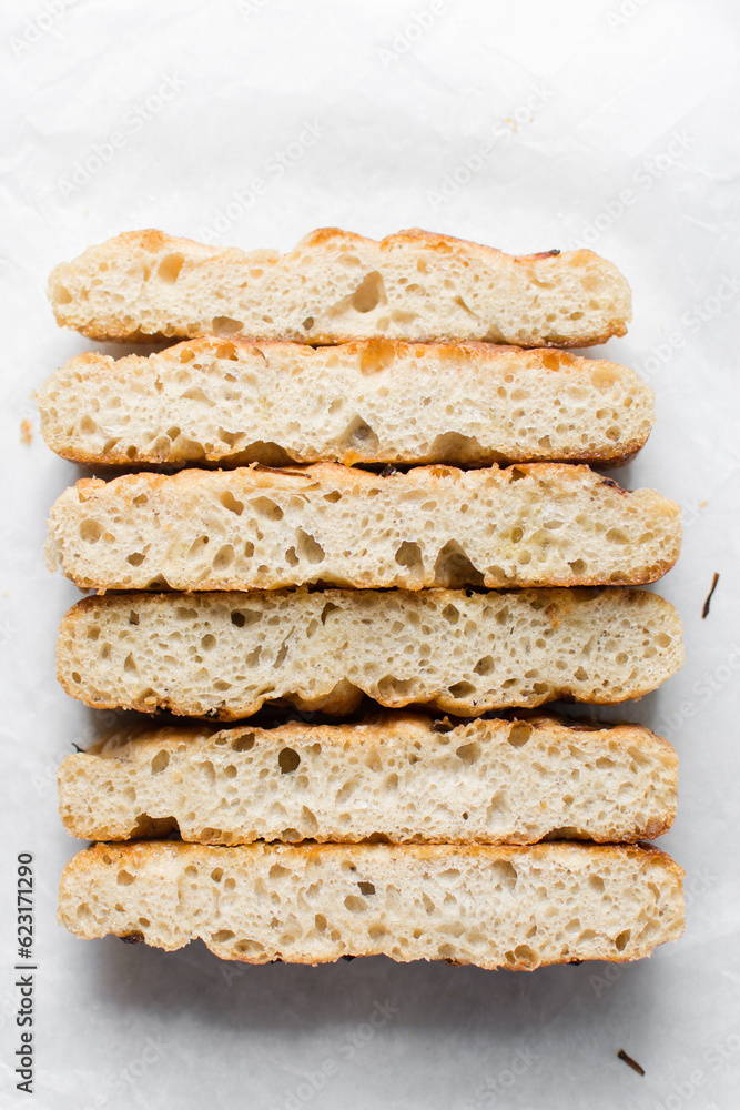 Top view of homemade onion focaccia on a white background, Flatlay of focaccia with red onion topping, fresh homemade focaccia bread Top view of homemade onion focaccia on a white background, Flatlay of focaccia with red onion topping, fresh homemade focaccia bread