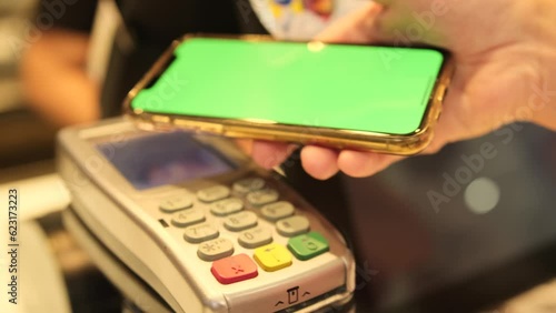 Wallpaper Mural Contactless payment with smartphone in store, chromakey. Purchase by cell-phone on electronic payment machine or card reader. Modern wireless tech user concept. Torontodigital.ca