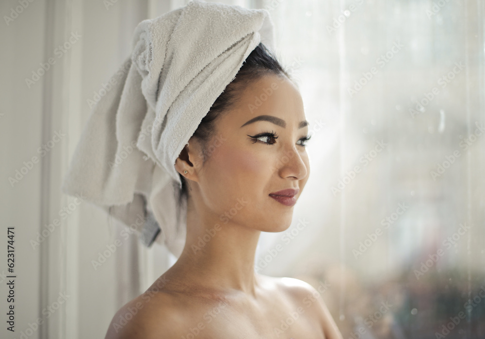 Fototapeta premium portrait of asian woman with towel on her head