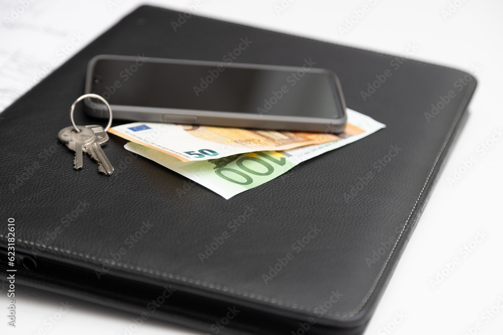 Coins, house key wallet and house drawing on the table. Crime for rent payment. Make money by business idea concept image close up. Concept image of buying a house Coins, house key wallet and house drawing on the table. Crime for rent payment. Make money by business idea concept image close up. Concept image of buying a house