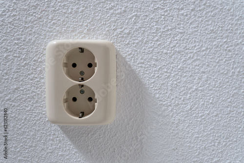 surface double socket at white wall