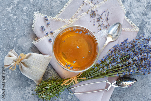 Bunch of lavender flowers, sachet filled with dried lavender and healthy tea. Top view. Flat lay.