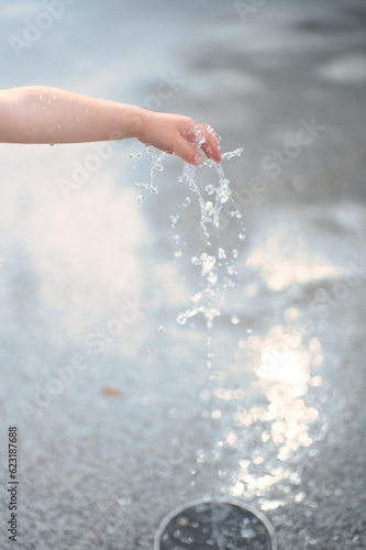 boy's hand and water