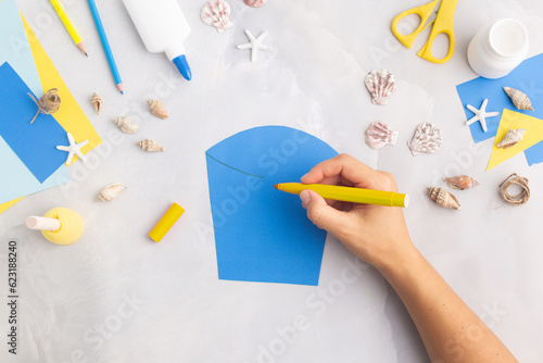 Paper bucket of shells summer idea for kids craft in kindergarten hands ocean's day