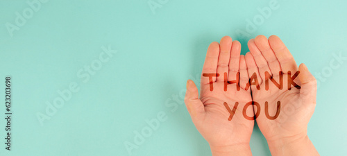 Thank you is standing on the hands, being thankful, support, help and charity concept, positive attitude 