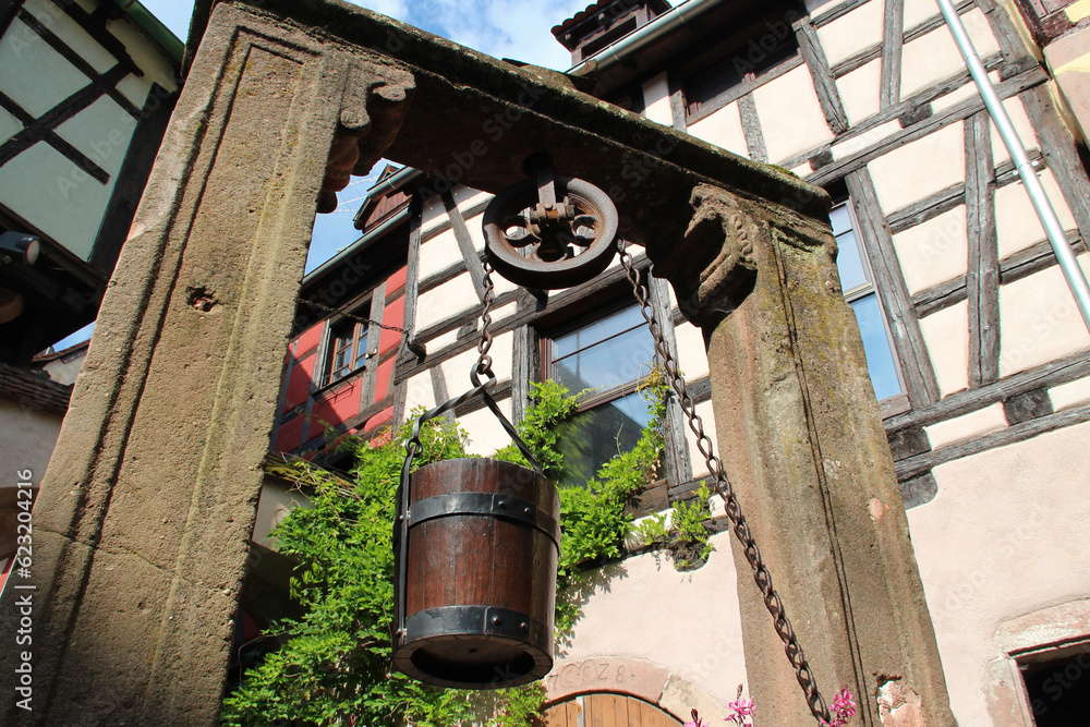 well and half-timbered houses in riquewihr in alsace (france) well and half-timbered houses in riquewihr in alsace (france)