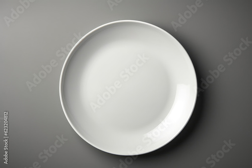 White Monochrome Plate On Grey Background, Top View. Generative AI photo