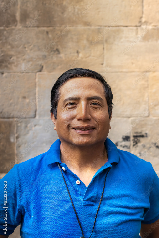 Street portrait of a smiling Peruvian man in the city of Barcelona (Spain).