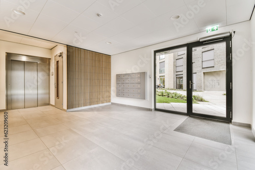 Foto an empty office space with glass doors and white tiles on the floor, there is no