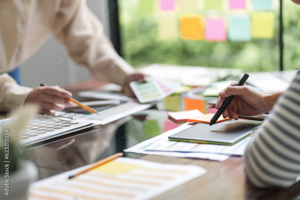 Startup creative designer women planing a project ideas with color palette.. Startup creative designer women planing a project ideas with color palette..