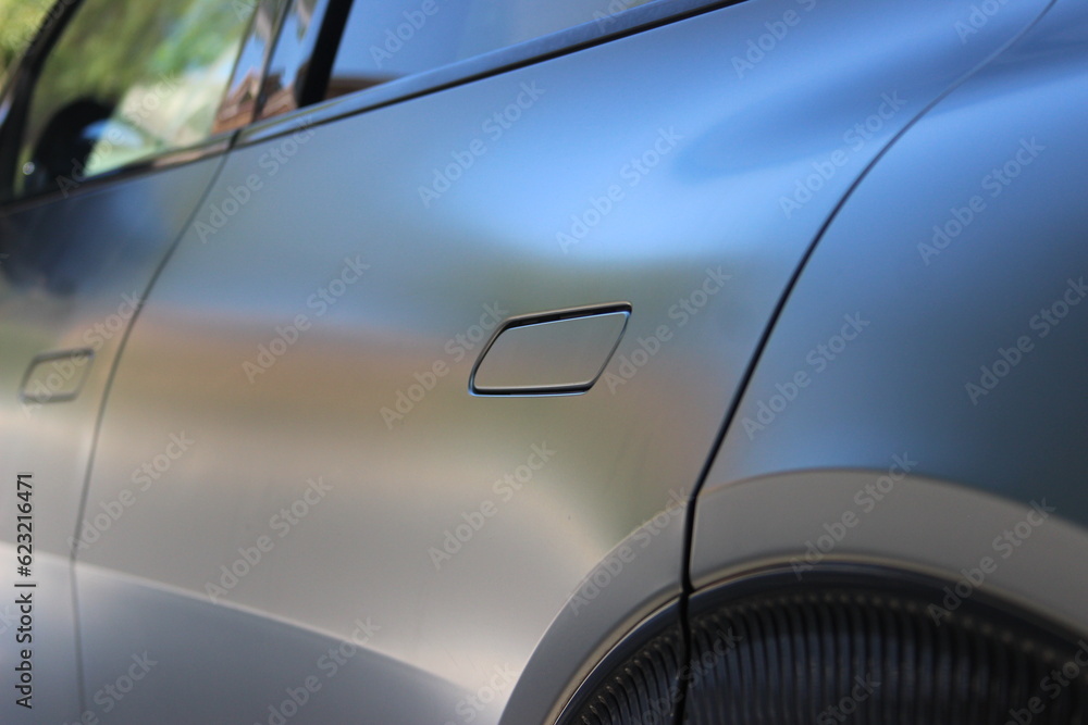 Closeup of silver crossover vehicle background image.
