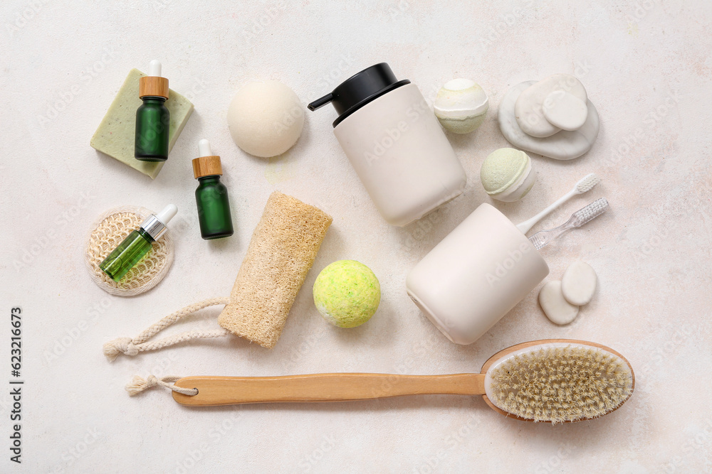 Composition with different bath accessories and cosmetics on light background Composition with different bath accessories and cosmetics on light background