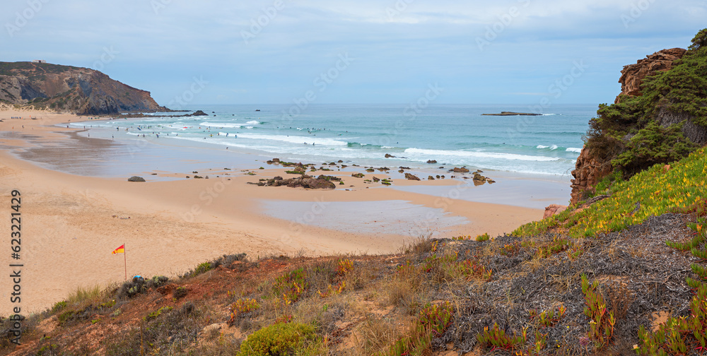 sandy bay Amado beach and rocky coast, atlantic ocean West Algarve Portugal sandy bay Amado beach and rocky coast, atlantic ocean West Algarve Portugal
