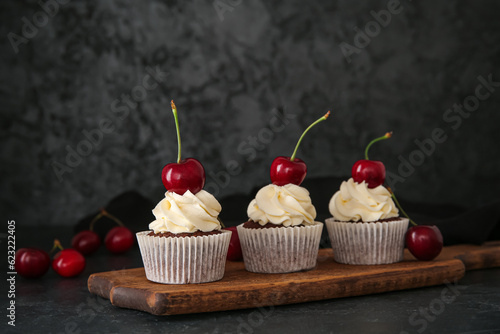 Three chocolate cupcakes wi...