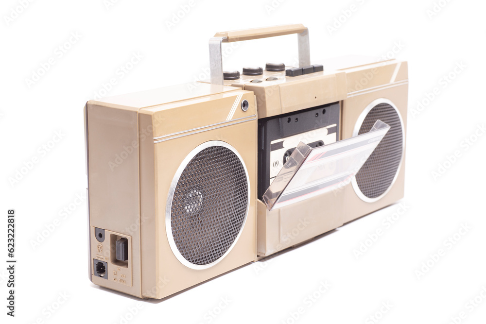 Fototapeta premium Retro portable stereo cassette recorder from 80s. with audio cassette tape. English translation: on, off (inscription in Russian)
