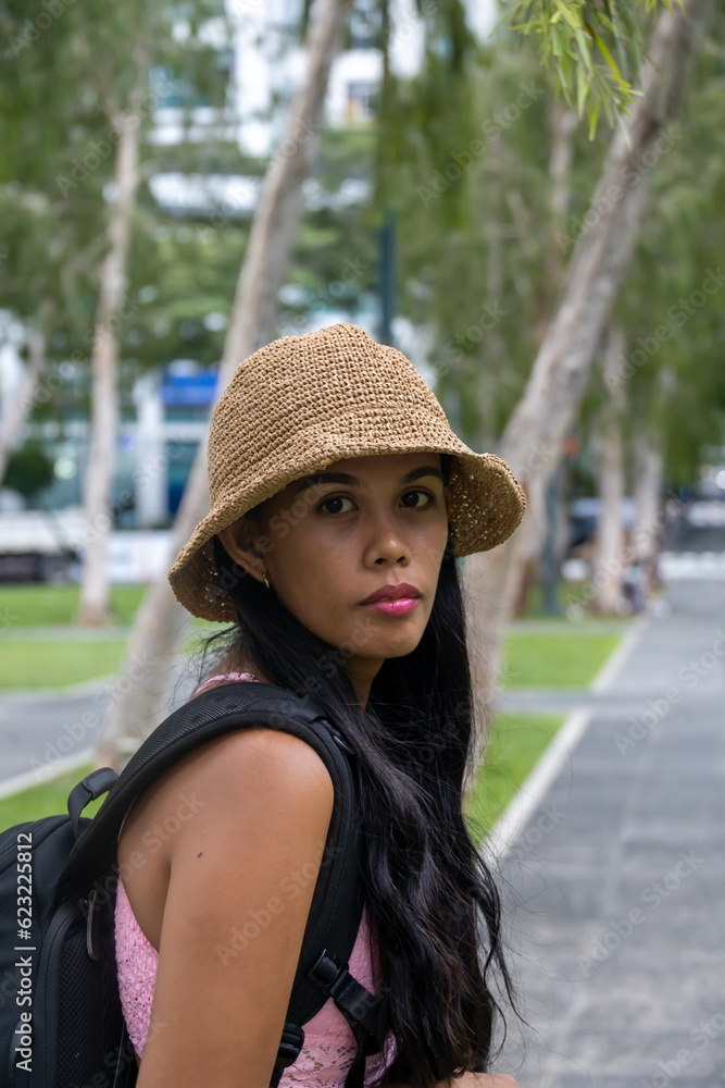 girl with a hat in the city