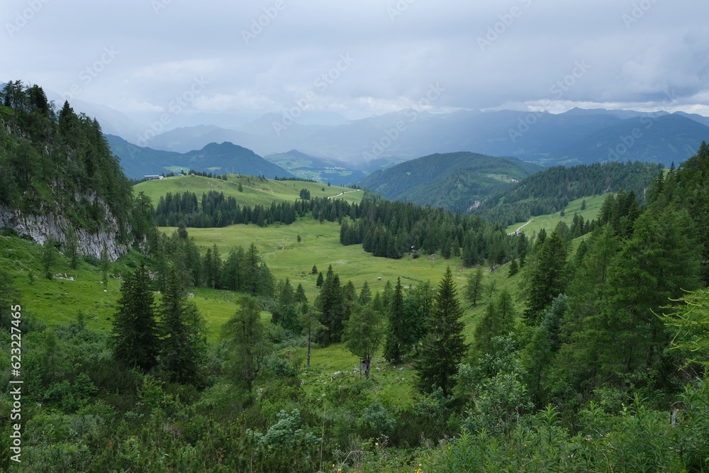 Beautiful green valley in mountains. Summer mountains views during hiking from Gosau Valley to Donnerkogel peak in Austrian Alps