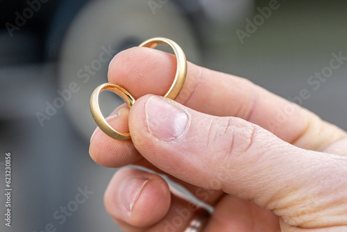 In man fingers are two wedding rings Wedding tradition Gold rings