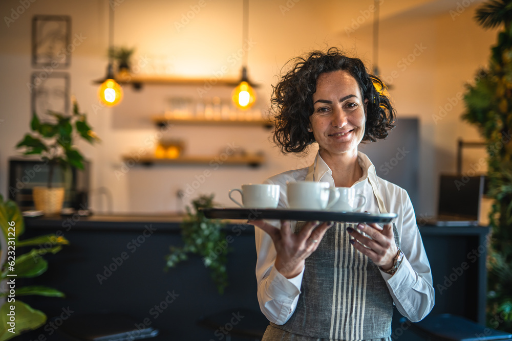 One mature woman caucasian waitress at cafe or restaurant carry tray - obrazy, fototapety, plakaty 