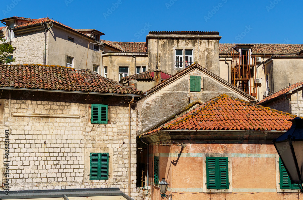 street view of the old town of Kotor in Montenegro, medieval European architecture, city streets, red tiled roofs, the concept of traveling across the Balkans