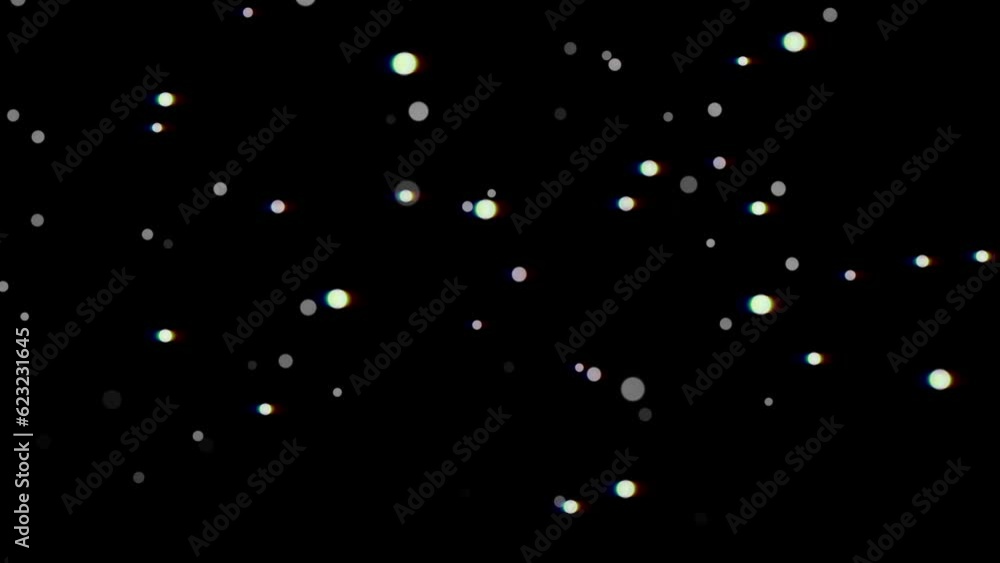 Animation of falling colorful particles on a dark background. Animation of falling colorful particles on a dark background.