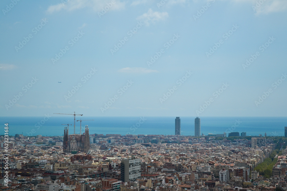 Magnificent Barcelona: Skyline Featuring the Majestic Sagrada Família and the Sea in the Background