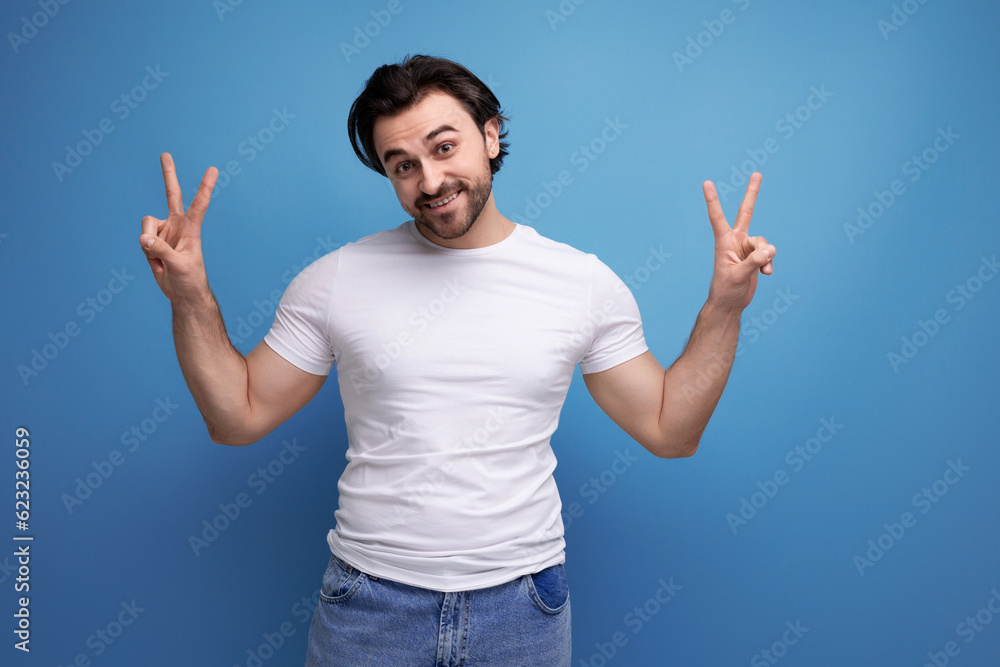 portrait of a successful brutal brunette man with enthusiastic emotions portrait of a successful brutal brunette man with enthusiastic emotions