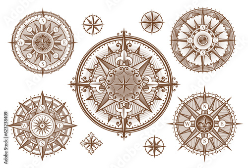 Vintage medieval antique wind rose compass engravings with sun and stars. Vector ancient compass woodcuts with ornate arrows of North, East, West, South directions, victorian fleur-de-lis and scrolls