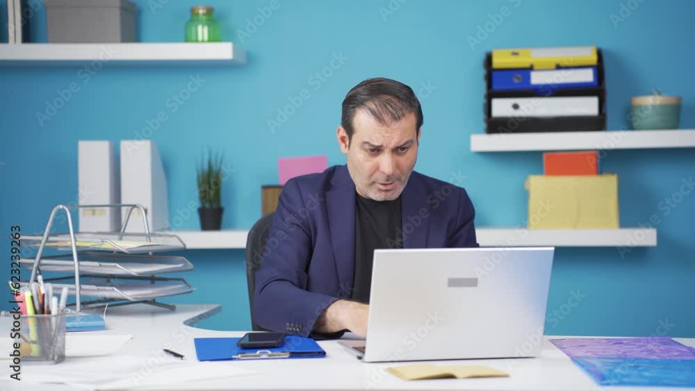 The businessman who sees bad events on the laptop gets angry. The businessman who sees bad events on the laptop gets angry.