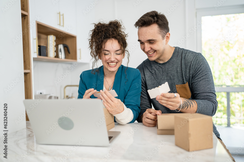 couple woman and man open presents and read card while on video call couple woman and man open presents and read card while on video call