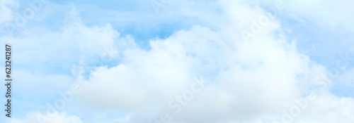 Beautiful blue sky and white clouds of various shapes with sunlight. Nature background