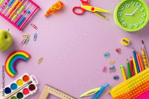 Explore the wonders of early education with this top-down perspective: a captivating arrangement of child stationery on pastel purple backdrop, offering copyspace for text or advertising content