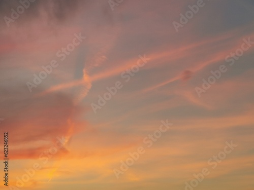 The sunset sky is decorated with clouds in various shapes, very beautiful.
