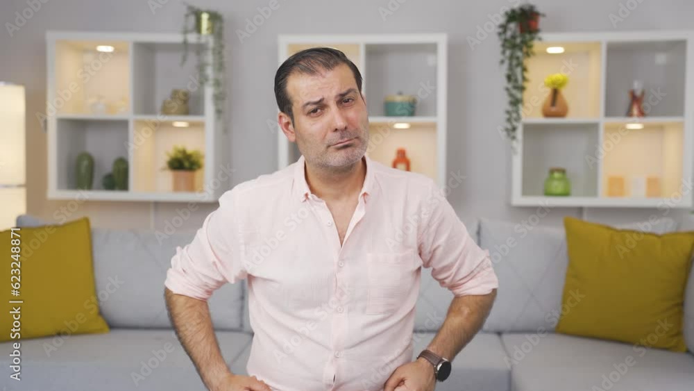 Man looking at camera with dull expression. Man looking at camera with dull expression.