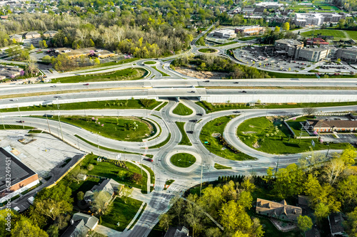 A drone view of a group of roundabouts and a highway