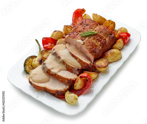 sliced roast pork with vegetables and sauce