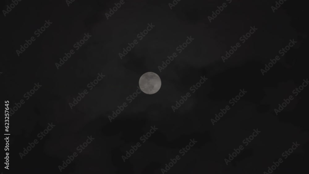Full Moon in the Night with Clouds Real Time Footage. Full Moon in the Night with Clouds Real Time Footage.